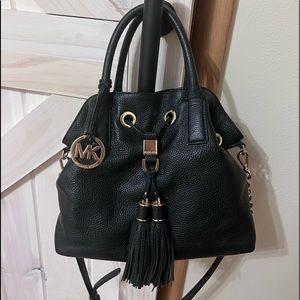Medium sized black Michael Kors purse